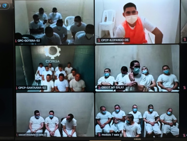 This handout image released by El Salvador's Attorney General's Office on April 1, 2026, shows a mass trial of alleged gang members held over video call - Handout (AFP)