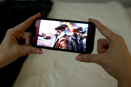 "Whiskey & Water," a song by Cain Walker featuring Cade Winslow, is one of many AI-generated country music tunes - TIMOTHY A. CLARY (AFP)