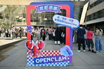 People lining up to have  OpenClaw installed on their laptops at Baidu's headquarters in Beijing in March - ADEK BERRY (AFP)