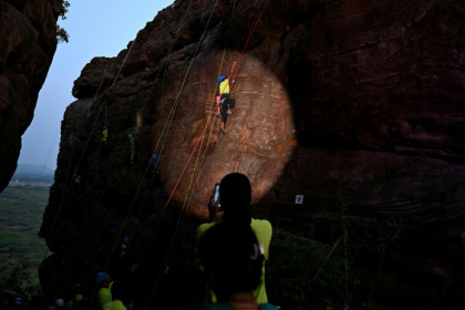 A climber scaling a rock wall in the Indian state of Karnataka - Sajjad HUSSAIN (AFP)