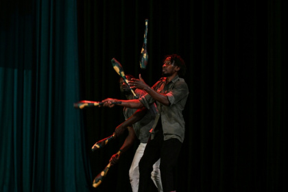 A performer mimes juggling spent ammunition left behind after a jihadist raid - Issouf SANOGO (AFP)
