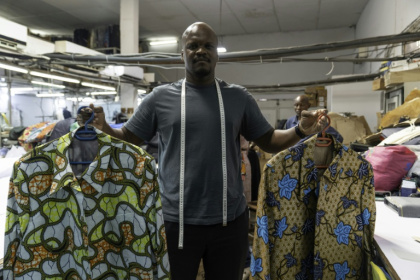 Serge Okasol, a tailor in Kinshasa, says the 'abacost' Mobutu-era jacket is currently all the trend - Glody MURHABAZI (AFP)