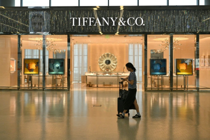 Even in financial hub Shanghai's swanky shopping districts, buyers still viscerally feel the uncertainty of the Covid pandemic - GREG BAKER (AFP)