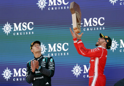 Ferrari's Lewis Hamilton (R) and second placed Mercedes' driver George Russell on the podium in Montmelo, on the outskirts of Barcelona - Lluis GENE (AFP)