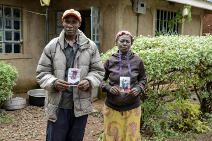 Moses Muyela and Josephine Ngoya hold photos of their son, who reportedly died in Ukraine - Brian ONGORO (AFP)