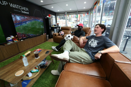 Austin Franklin (right) and Kevin Akoto have a dream job: Getting paid to watch all 104 games of the World Cup in a cube-like studio in the heart of New York's Times Square - TIMOTHY A. CLARY (AFP)