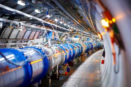 Some of the 1232 dipole magnets that bend the path of accelerated protons are pictured in the Large Hadron Collider (LHC), which will be shut down for four years of renovations - VALENTIN FLAURAUD (AFP)