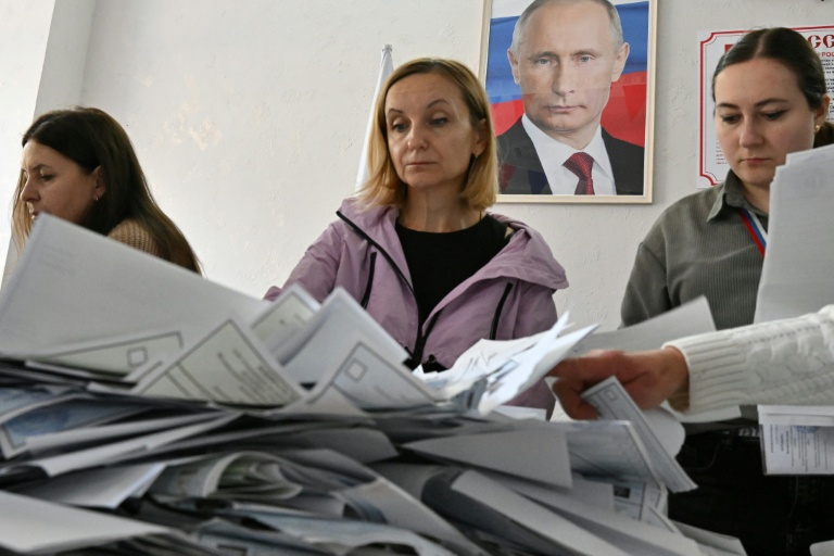 Putin's party set to retain power after Russia vote hit by cyberattacks, drones