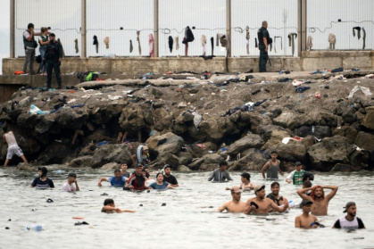 An unprecedented 72,000 people poured into Ceuta from Morocco from July 30, mostly by swimming - JORGE GUERRERO (AFP)