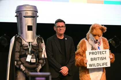 Count Binface stands next to Labour's Andy Burnham and a Protect British Wildlife candidate after the Makerfield by-election in June - Oli SCARFF (AFP)