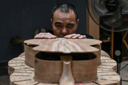 In a decade, one corner of China has become the producer of one in every seven guitars sold worldwide - Jade GAO (AFP)