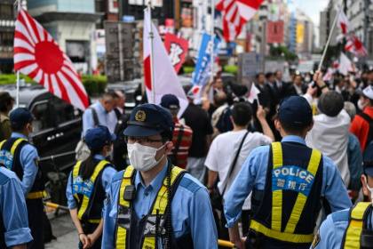 Foreign residents wishing to stay in Japan permanently will have to prove their annual income is above average - Andrew CABALLERO-REYNOLDS (AFP)