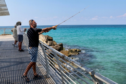Nahariya resident Maxim Zarbaylov says he is considering not backing Netanyahu for the first time - JACK GUEZ (AFP)