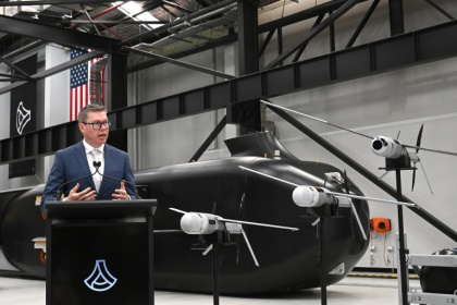 Australia's Minister for Defence Industry, Pat Conroy, speaks to the media in front of the autonomous undersea vehicle Ghost Shark at an Anduril facility in Sydney on October 19, 2026 - Saeed KHAN (AFP)