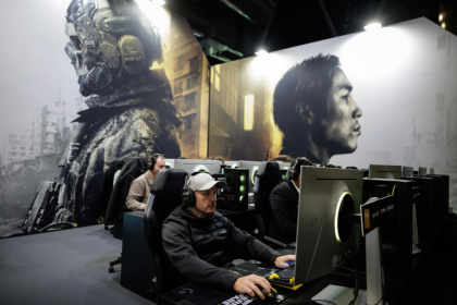 Visitors play 'Call Of Duty Modern Warfare 4' at a Paris preview last week. The game envisions a North Korean invasion of its southern neighbour - Simon WOHLFAHRT (AFP)